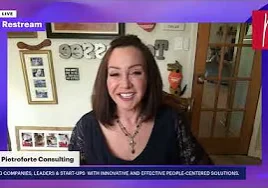 Woman in a dress on a TV screen, In the background, there are photo frames