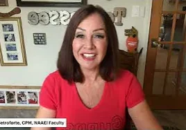 Smiling woman in red shirt